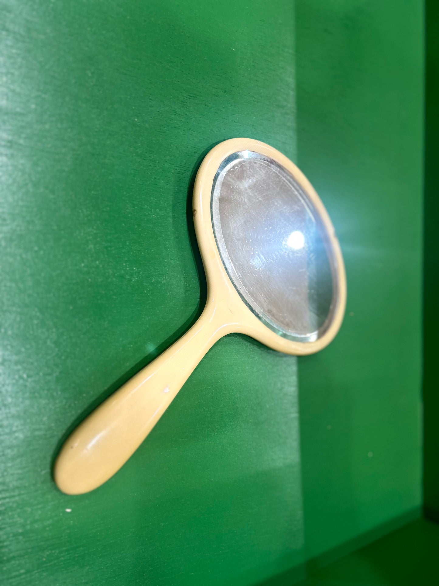 Antique Celluloid Oval Hand Mirror in Butterscotch